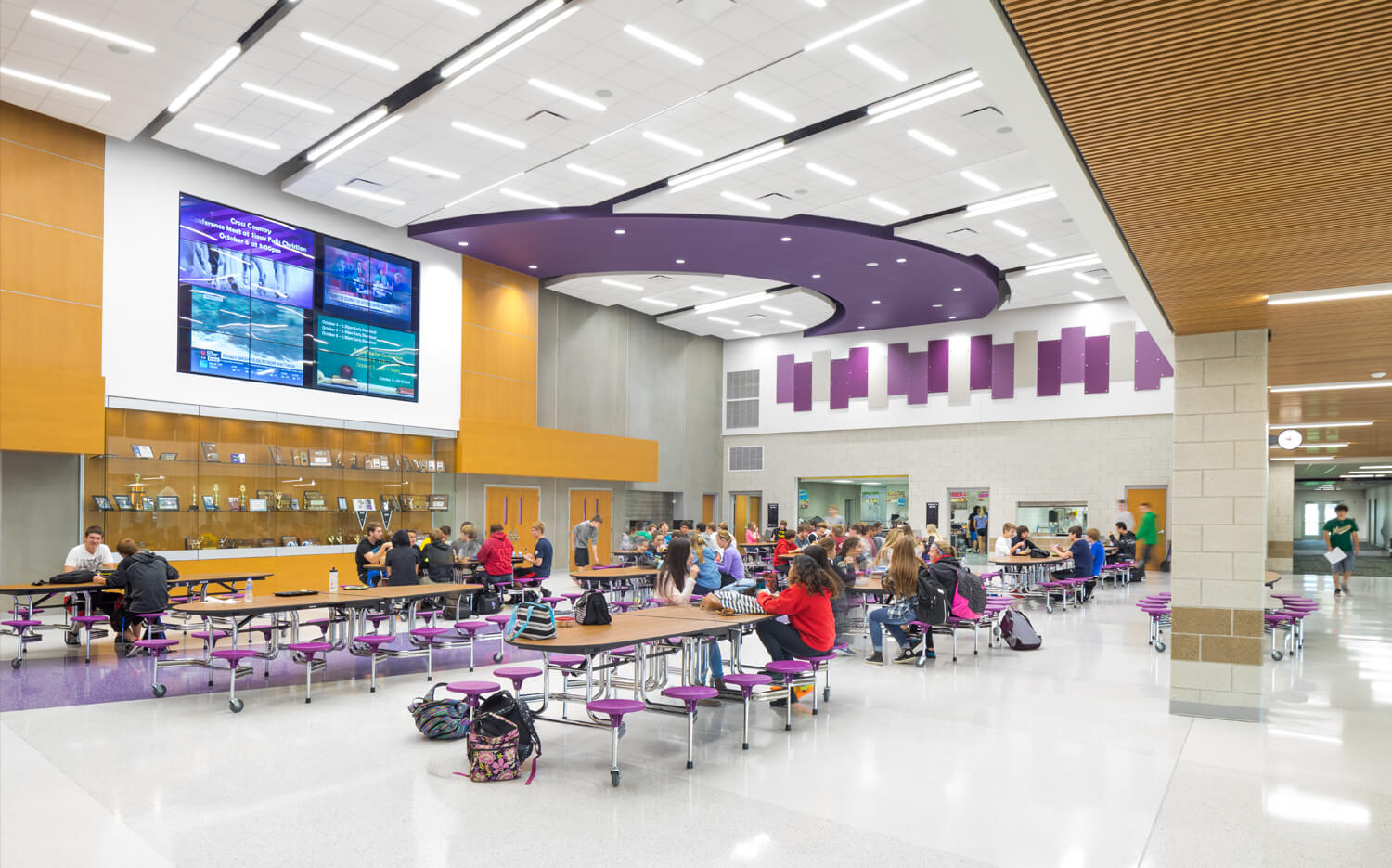 Dakota Valley high school commons area with students at the tables.